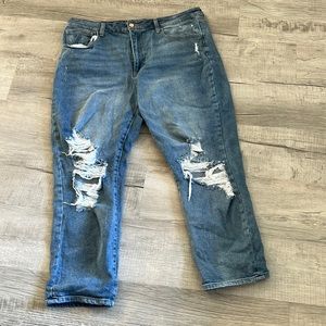 Light wash, distressed, mid-rise blue jeans.